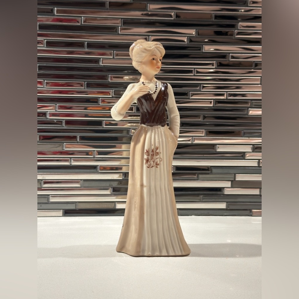 Elegant Figurine with Brown and Cream Dress